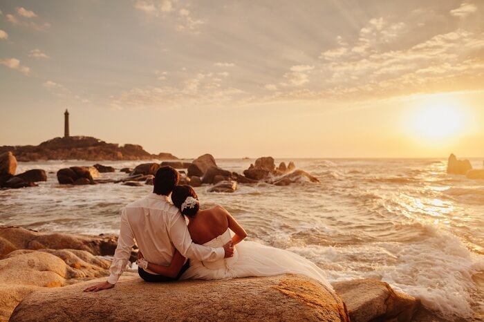 shutterstock_552748282-honeymoon-couple-relax-on-sunset-beach.-Sea-view-with.jpg